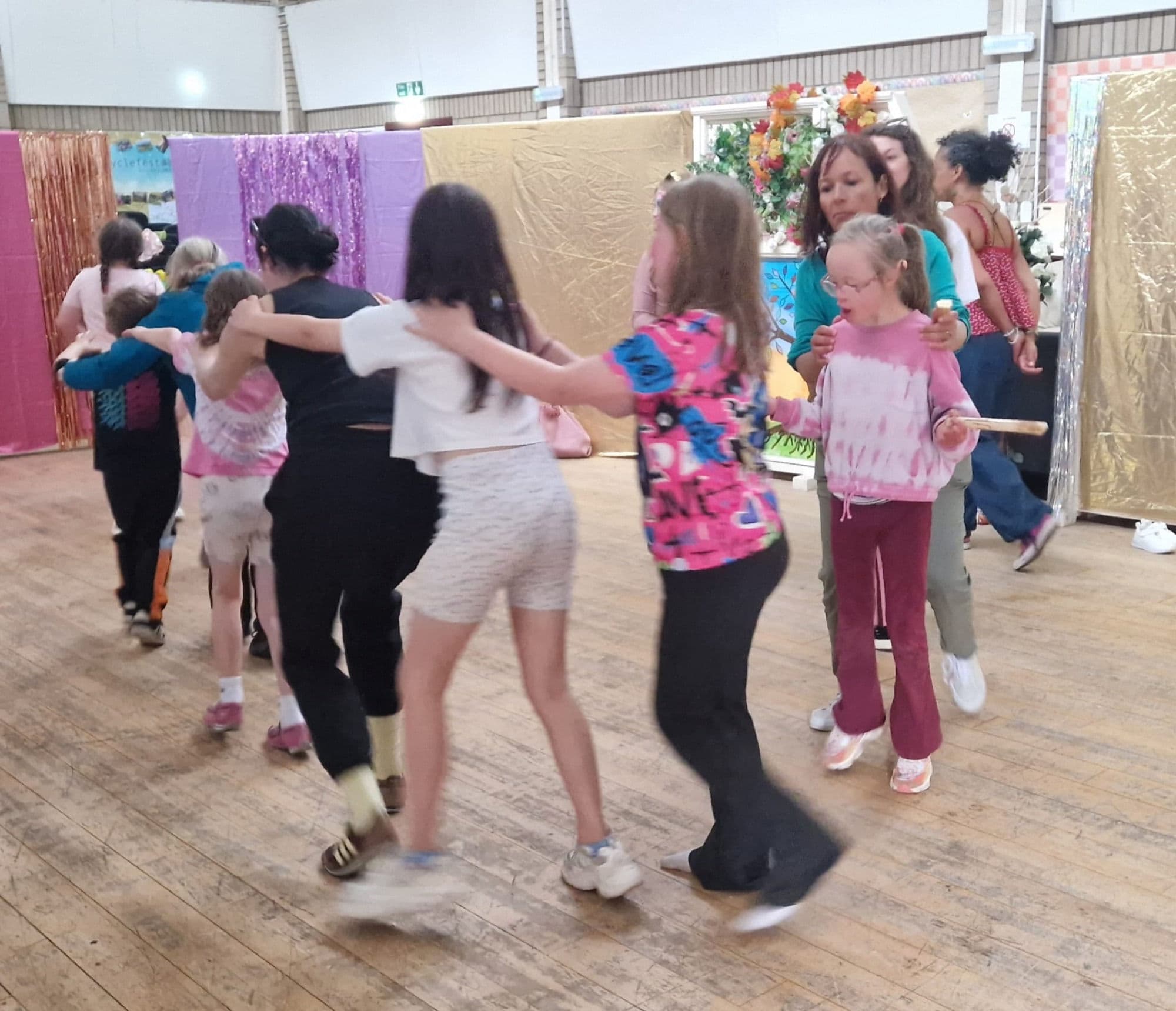 A conga line winding across the dance floor.