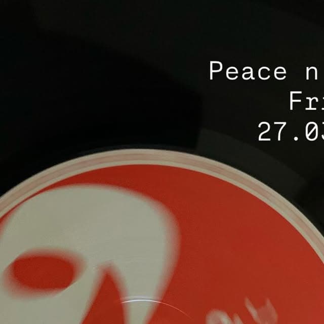 A close-up of a red vinyl record on a dark surface, overlaid with white text announcing a Peace n Jam night on Friday 27 March